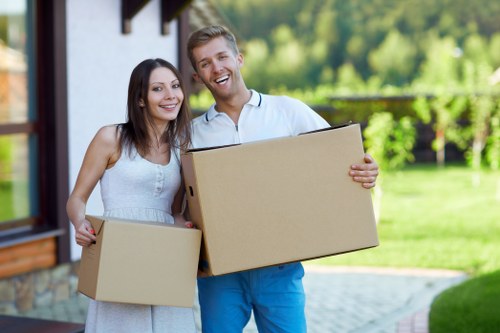 Careful packing of household items by a Southgate moving team