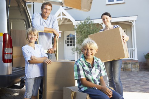 Professional movers handling furniture during Southgate removals
